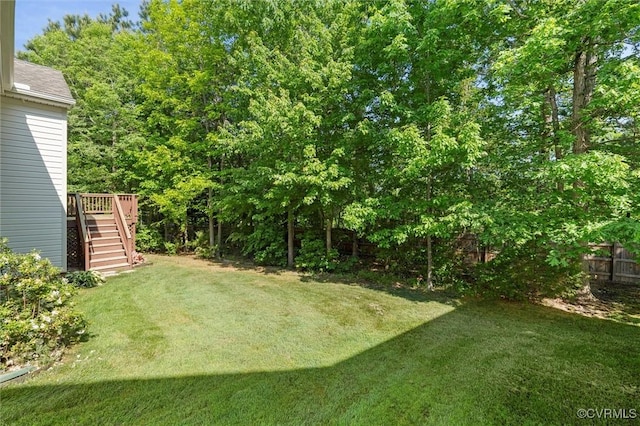 view of yard featuring stairs and a deck