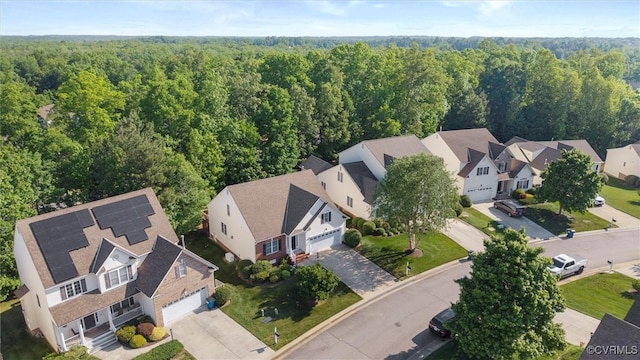 aerial perspective of suburban area featuring a forest