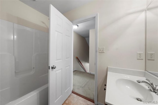 bathroom with vanity and bathtub / shower combination