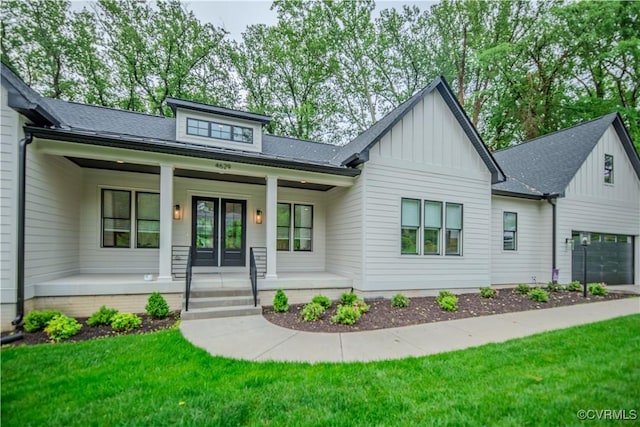 4629 Butte Rd, Richmond, VA 23235 - view of front facade featuring board and batten siding, covered porch, and a front lawn
