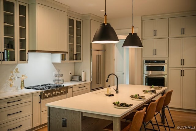 4629 Butte Rd, Richmond, VA 23235 - kitchen featuring a sink, stainless steel appliances, a breakfast bar area, light countertops, and recessed lighting