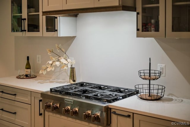 4629 Butte Rd, Richmond, VA 23235 - kitchen with stainless steel gas stovetop, light countertops, and glass insert cabinets