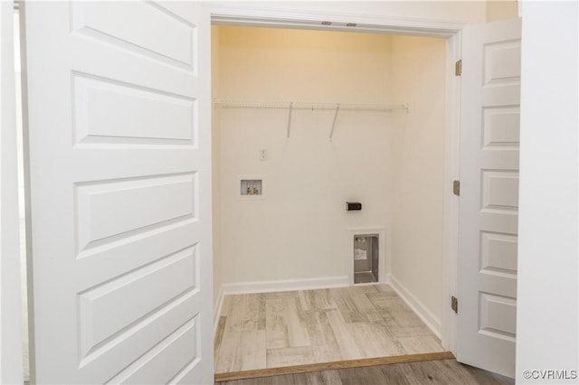 laundry room with washer hookup, laundry area, electric dryer hookup, baseboards, and light wood finished floors