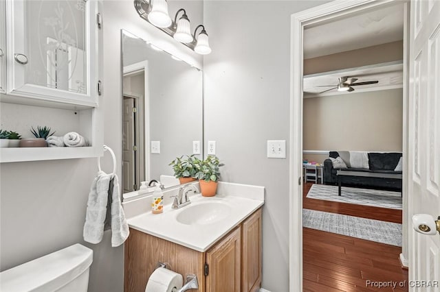 921 Hanson Dr, Newport News, VA 23602 - bathroom with vanity, a ceiling fan, wood finished floors, and toilet