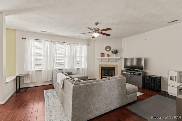 921 Hanson Dr, Newport News, VA 23602 - living area featuring baseboards, a ceiling fan, dark wood finished floors, and a fireplace