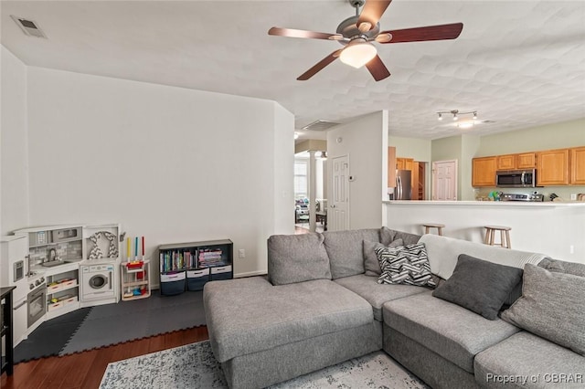 921 Hanson Dr, Newport News, VA 23602 - living room with a ceiling fan, visible vents, and wood finished floors