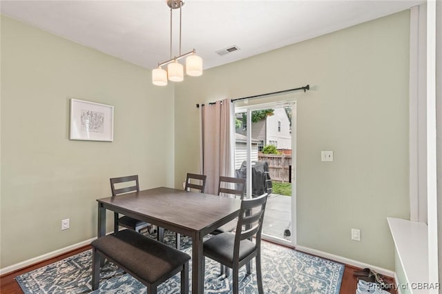 921 Hanson Dr, Newport News, VA 23602 - dining area with visible vents, baseboards, and wood finished floors