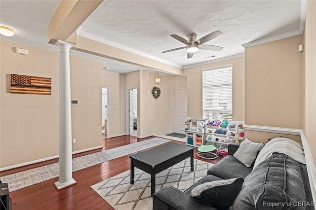 921 Hanson Dr, Newport News, VA 23602 - living area featuring a ceiling fan, wood finished floors, baseboards, ornamental molding, and ornate columns
