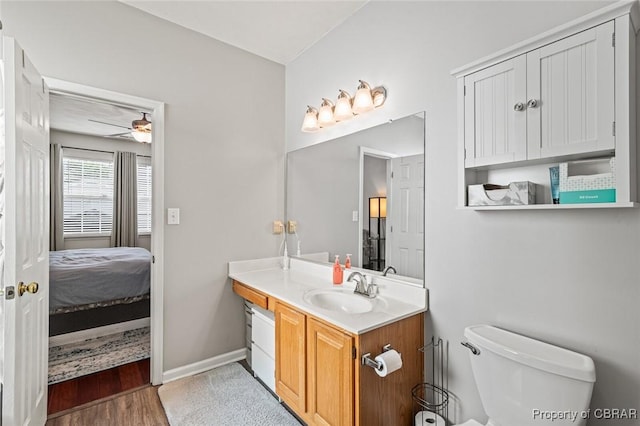 921 Hanson Dr, Newport News, VA 23602 - bathroom with connected bathroom, ceiling fan, vanity, toilet, and baseboards