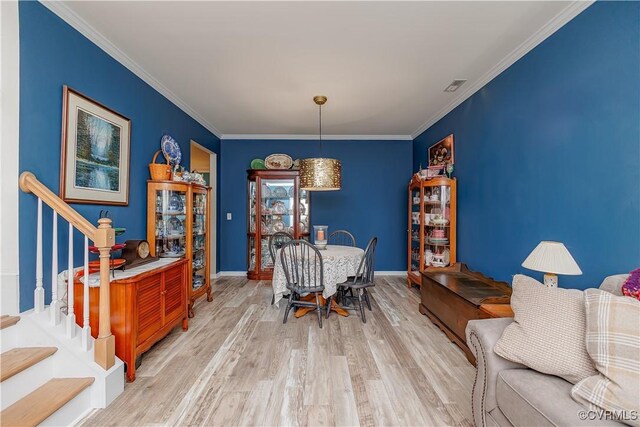 4716 Fulton St, Richmond, VA 23231 - dining room featuring stairs, wood finished floors, and ornamental molding