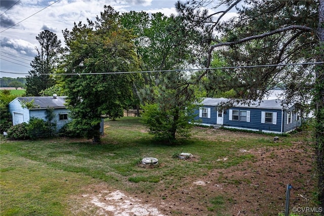 exterior space featuring a garage and a front lawn