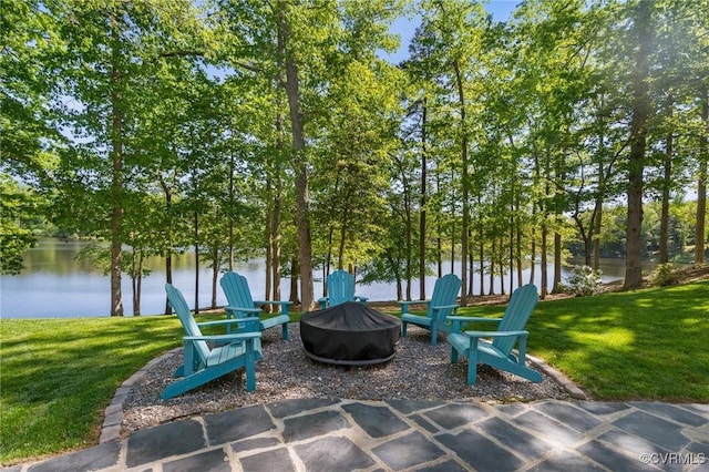 view of patio / terrace with a water view and an outdoor fire pit