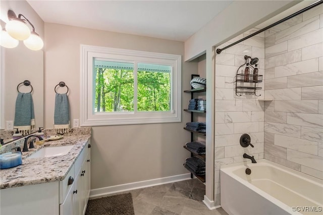 bathroom featuring baseboards, marble finish floor, shower / bath combination, and vanity