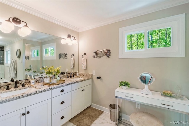 bathroom with baseboards, a sink, a wealth of natural light, and ornamental molding