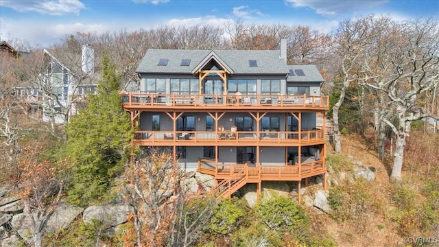 380 Blackrock Cir, Wintergreen, VA 22967 - rear view of house with a deck, a chimney, and roof with shingles