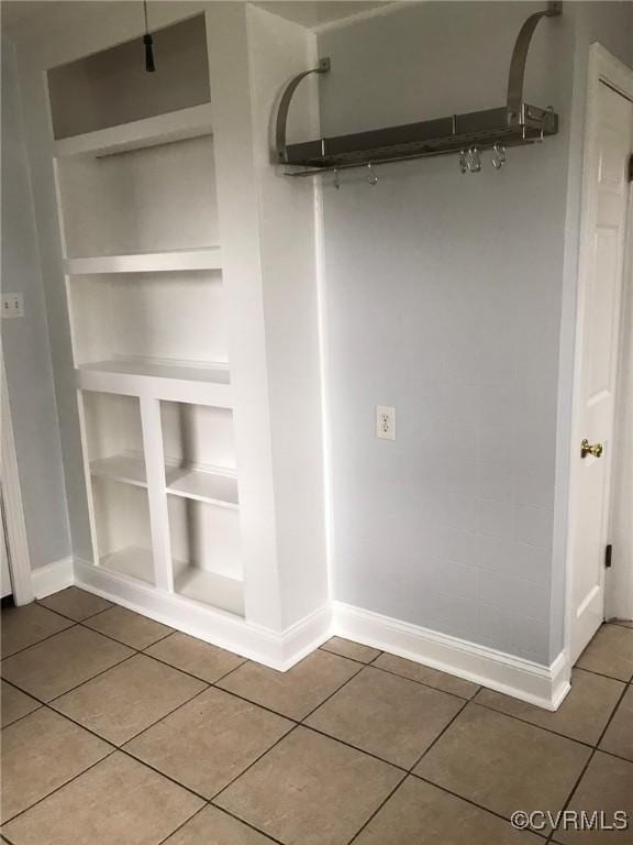 details with baseboards and built in shelves