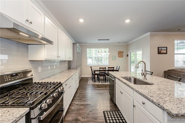 7585 Sedge Dr, New Kent, VA 23124 - kitchen with stainless steel appliances, under cabinet range hood, dark wood finished floors, ornamental molding, and white cabinetry