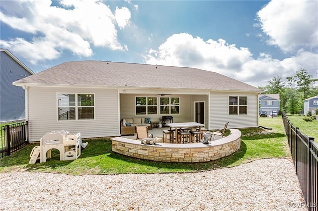 7585 Sedge Dr, New Kent, VA 23124 - rear view of house featuring a fenced backyard, a patio, and outdoor lounge area