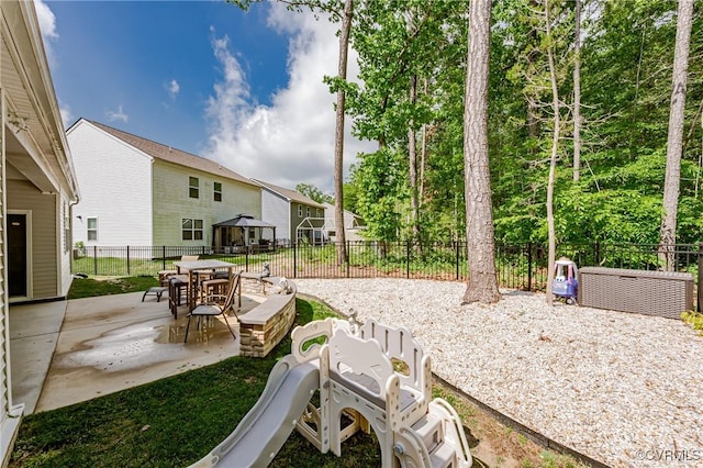 7585 Sedge Dr, New Kent, VA 23124 - fenced backyard featuring a patio area, a gazebo, and outdoor dining space