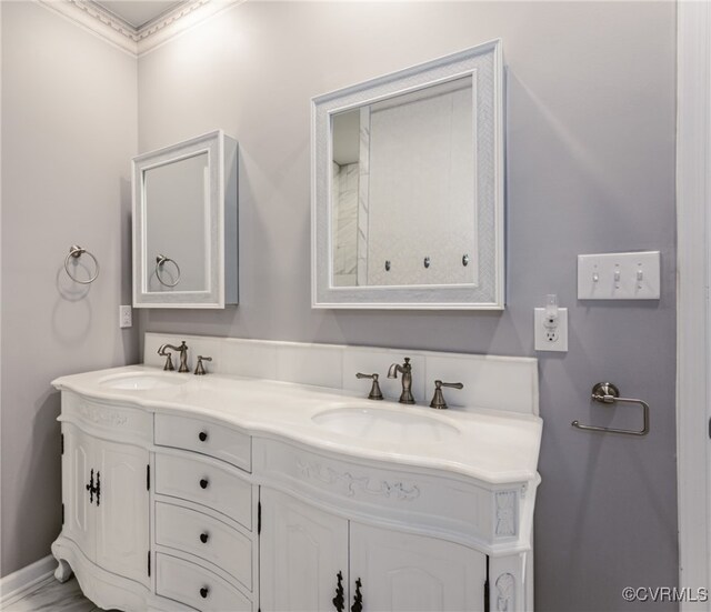 7585 Sedge Dr, New Kent, VA 23124 - bathroom with double vanity and ornamental molding