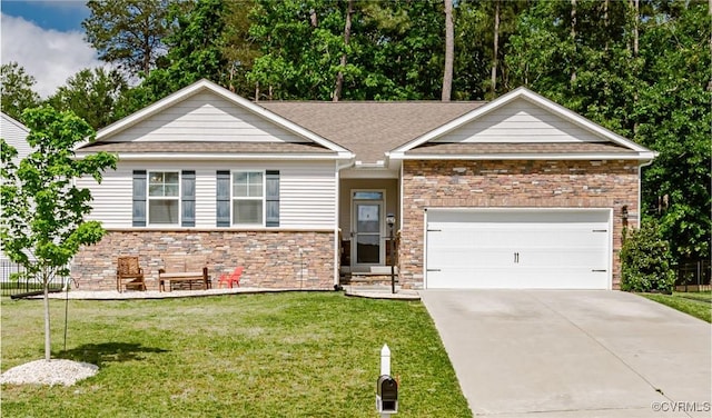 7585 Sedge Dr, New Kent, VA 23124 - view of front facade with a front yard, concrete driveway, a garage, and stone siding