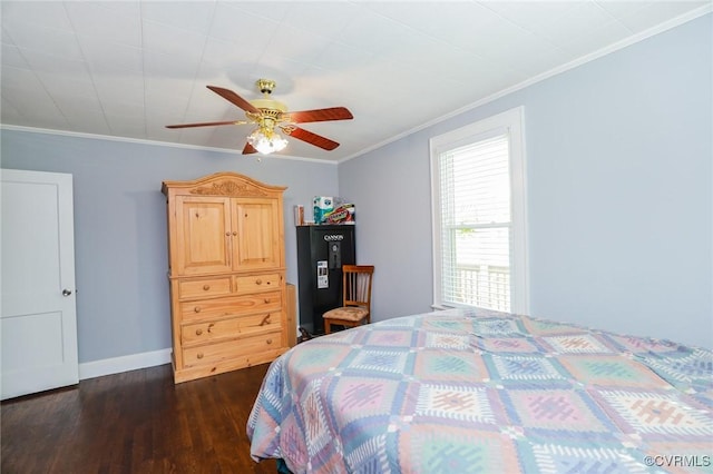 bedroom featuring baseboards, ornamental molding, a ceiling fan, and dark wood-style flooring