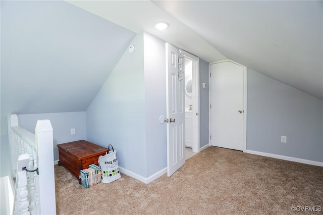 additional living space with baseboards, recessed lighting, carpet, and lofted ceiling