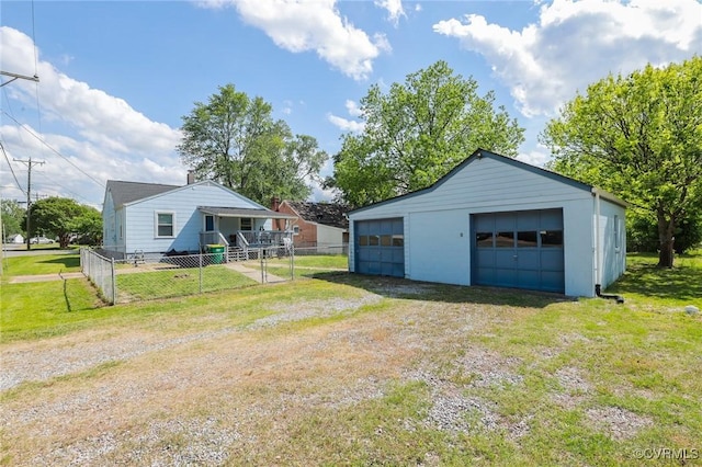 detached garage featuring fence