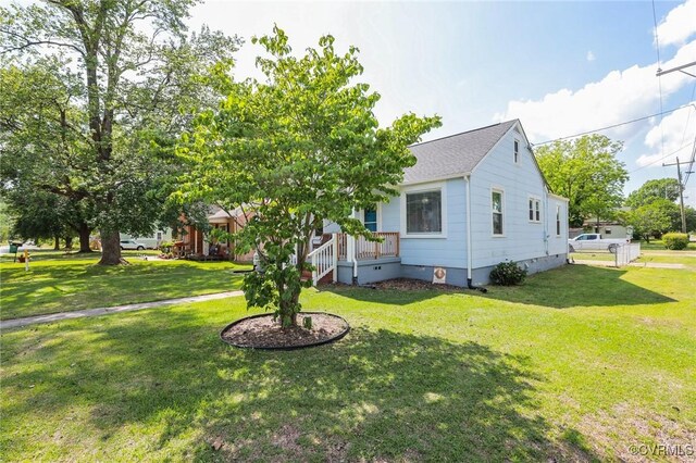 view of front of property with crawl space, a front yard, and roof with shingles