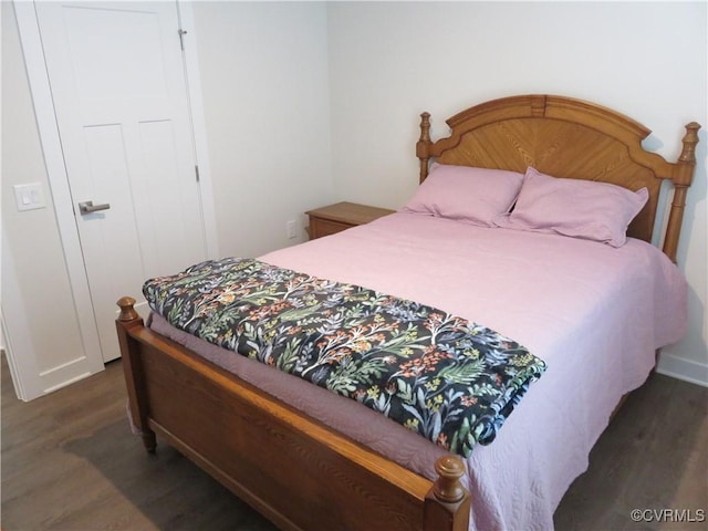 bedroom featuring wood finished floors