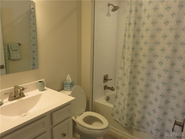 bathroom featuring vanity, toilet, and shower / bath combo with shower curtain