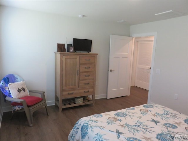 bedroom featuring wood finished floors