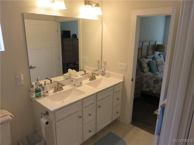 ensuite bathroom with double vanity, a sink, and ensuite bathroom