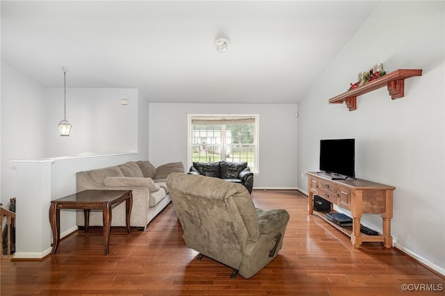 608 Southampton Dr, Ruther Glen, VA 22546 - living area with wood finished floors, vaulted ceiling, and baseboards