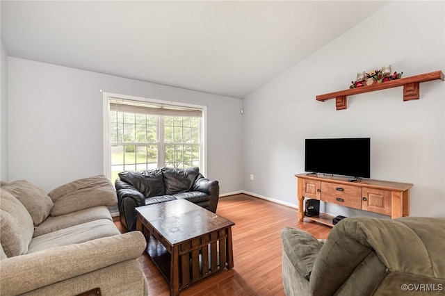 608 Southampton Dr, Ruther Glen, VA 22546 - living room with lofted ceiling, wood finished floors, and baseboards