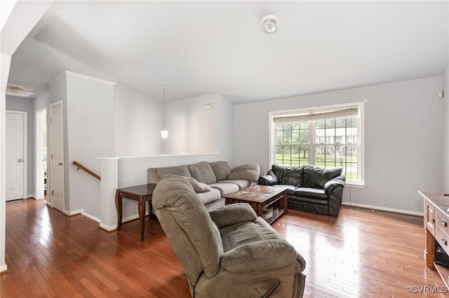 608 Southampton Dr, Ruther Glen, VA 22546 - living area featuring wood-type flooring, baseboards, and lofted ceiling