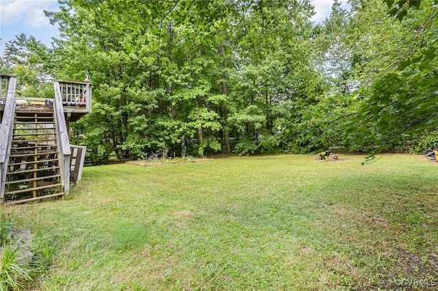 608 Southampton Dr, Ruther Glen, VA 22546 - view of grassy yard featuring stairway and a wooden deck