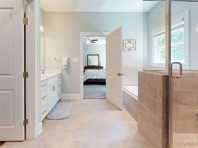 bathroom featuring a ceiling fan, a bath, a stall shower, vanity, and connected bathroom