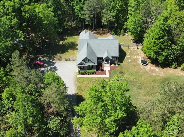 drone / aerial view featuring a view of trees