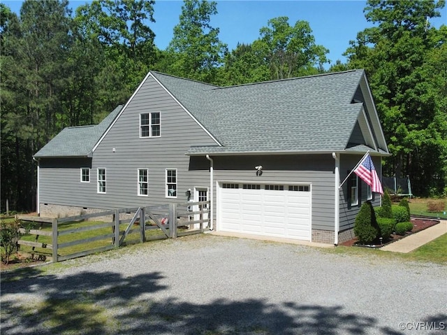 view of front of house with fence, a shingled roof, a garage, crawl space, and driveway