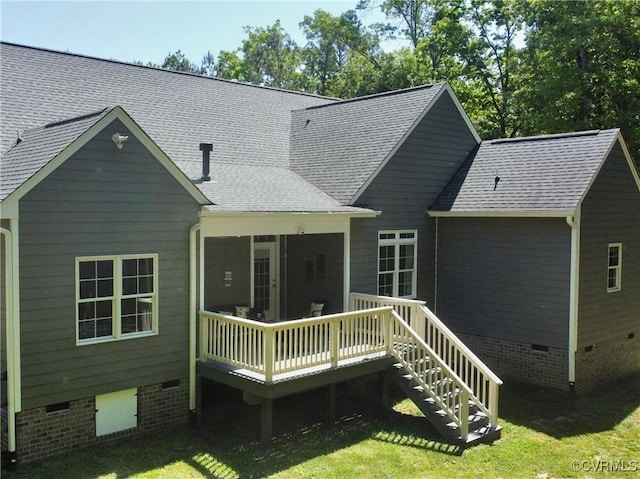 back of house with a sunroom, a yard, a deck, and crawl space