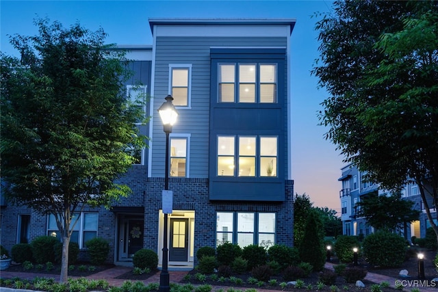 view of front of house with brick siding