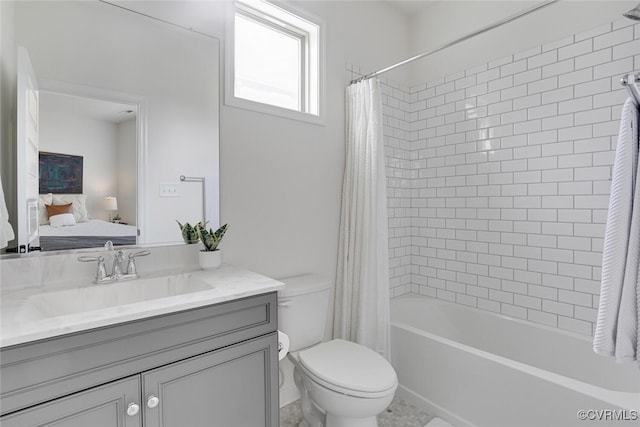 ensuite bathroom featuring vanity, ensuite bath, shower / bath combination with curtain, and toilet