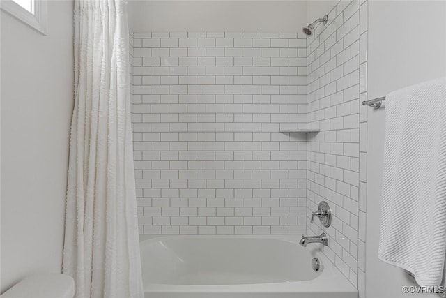 full bathroom with toilet and shower / bath combination with curtain