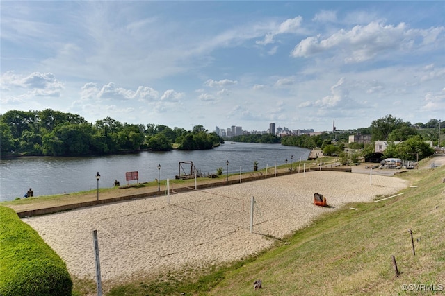 view of home's community featuring a water view and volleyball court