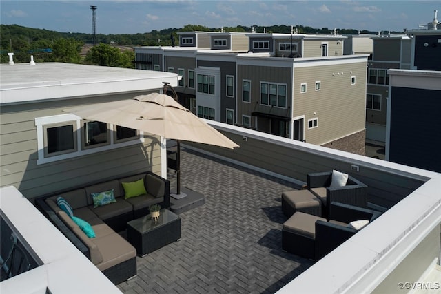 rear view of property featuring an outdoor living space