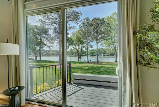 doorway with a water view and a baseboard radiator
