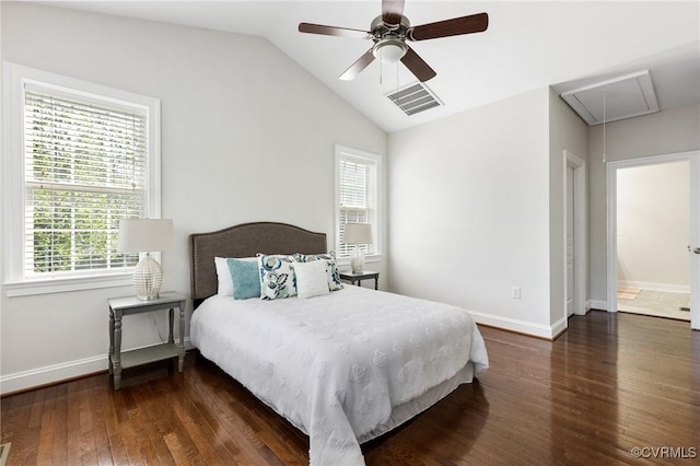 bedroom featuring wood-type flooring, attic access, visible vents, and multiple windows