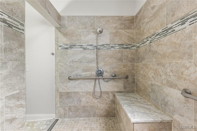full bathroom with tiled shower