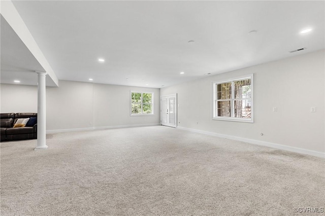 unfurnished living room featuring carpet, recessed lighting, and visible vents